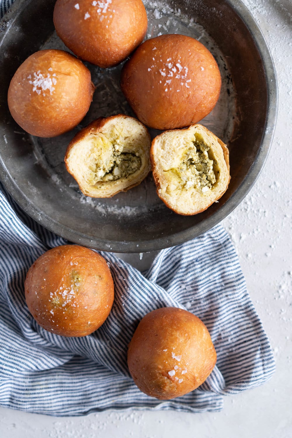 Basil Pesto and Feta Stuffed Savoury Brioche Doughnuts - Brioche dough is wrapped around a basil pesto and feta filling, then fried to golden brown perfection #savoury #savory #briochedoughnut #pestoandfeta #donut #brioche