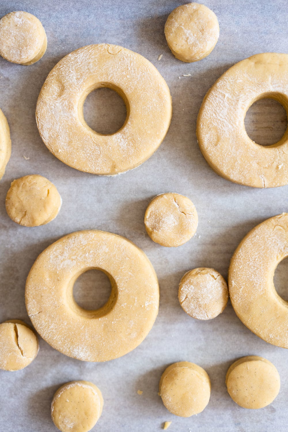 Vanilla Bean Old Fashioned Doughnuts - made as a cake doughnut rather than it's friend the yeast raised doughnut, old fashioned doughnuts are cakey and dense, fried to golden perfection, and then finished with a vanilla bean glaze. #oldfashioned #doughnuts #cakedoughnuts #cakedonut #vanillabean #staub