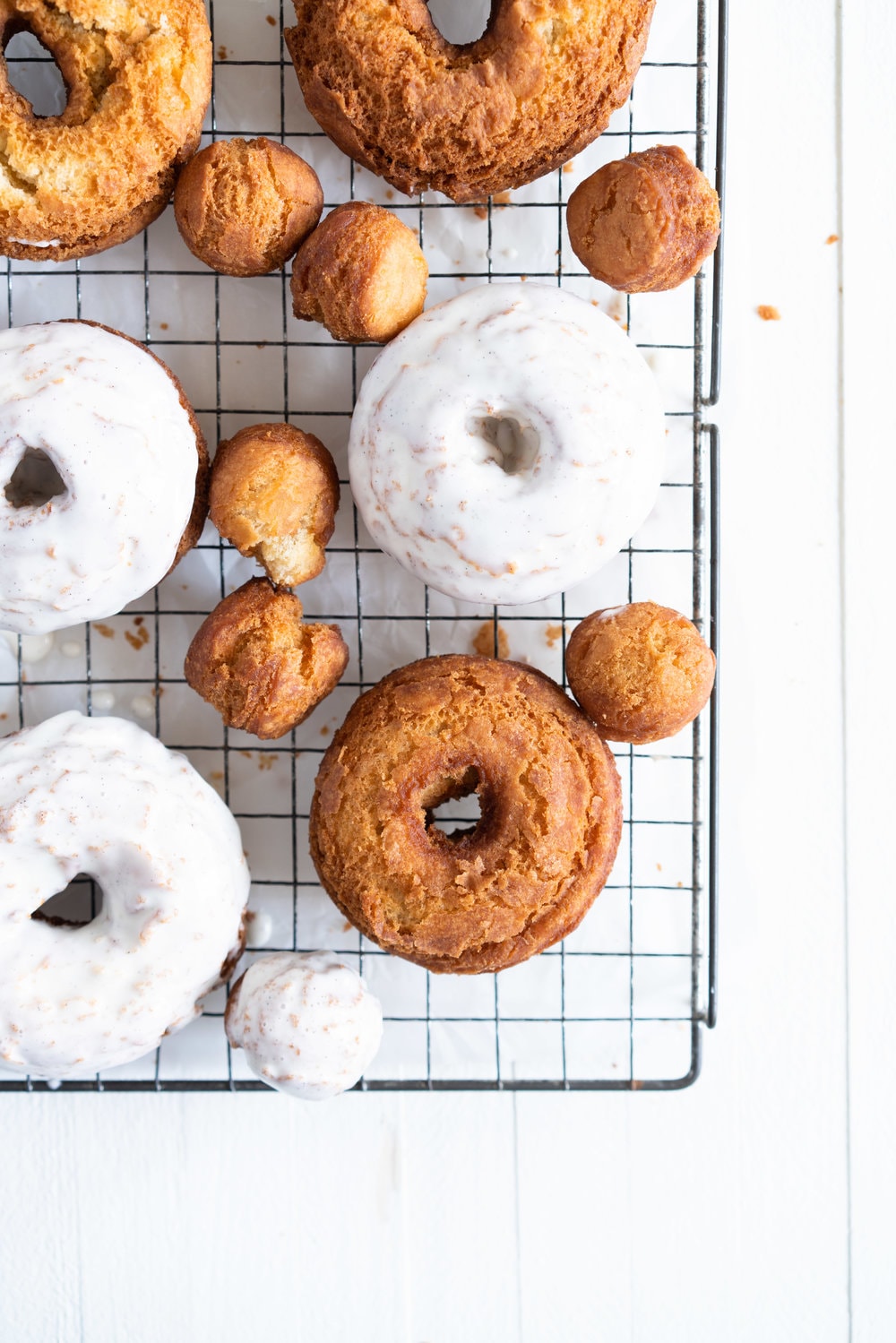 Vanilla Bean Old Fashioned Doughnuts - made as a cake doughnut rather than it's friend the yeast raised doughnut, old fashioned doughnuts are cakey and dense, fried to golden perfection, and then finished with a vanilla bean glaze. #oldfashioned #doughnuts #cakedoughnuts #cakedonut #vanillabean #staub