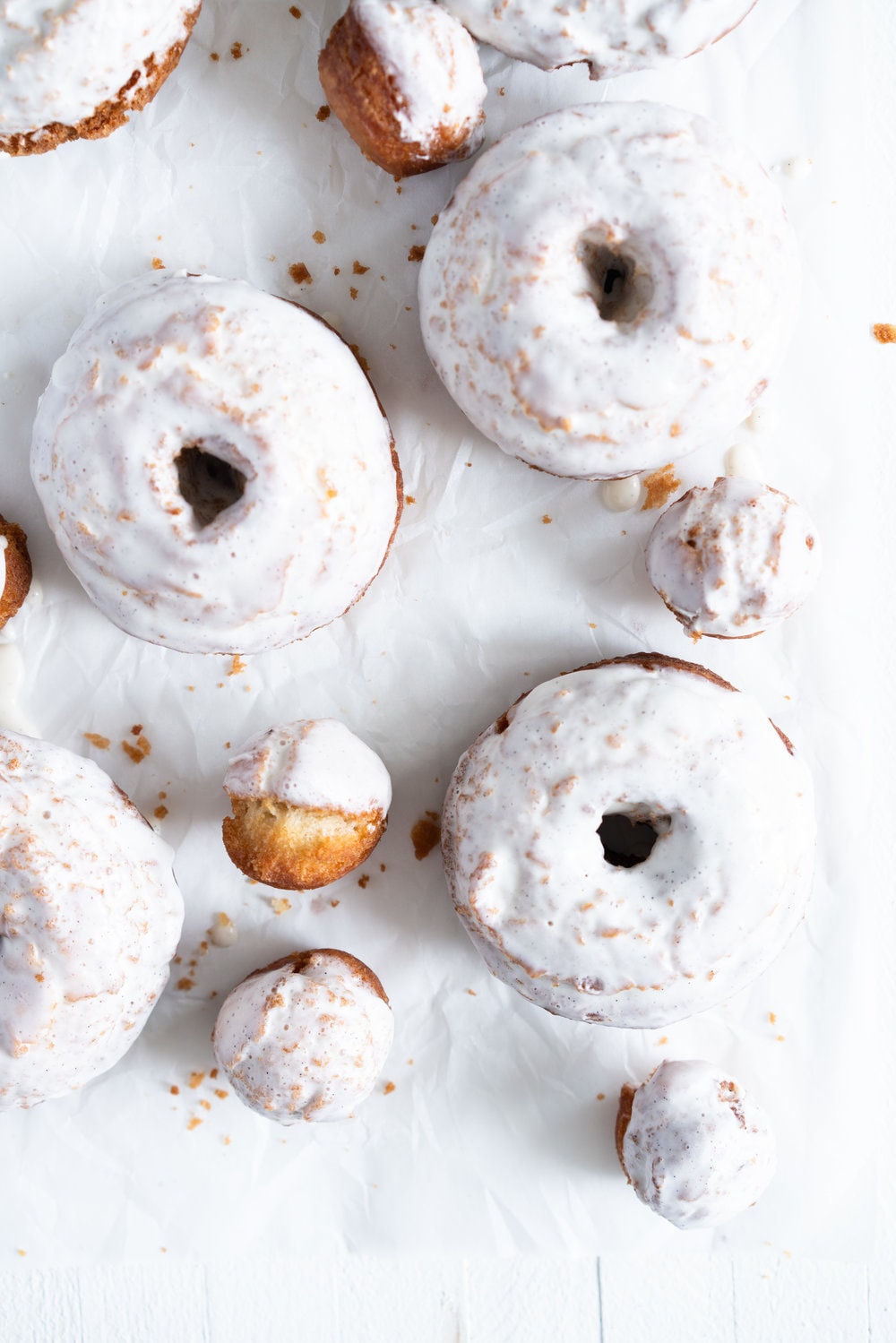 Vanilla Bean Old Fashioned Doughnuts - made as a cake doughnut rather than it's friend the yeast raised doughnut, old fashioned doughnuts are cakey and dense, fried to golden perfection, and then finished with a vanilla bean glaze. #oldfashioned #doughnuts #cakedoughnuts #cakedonut #vanillabean #staub