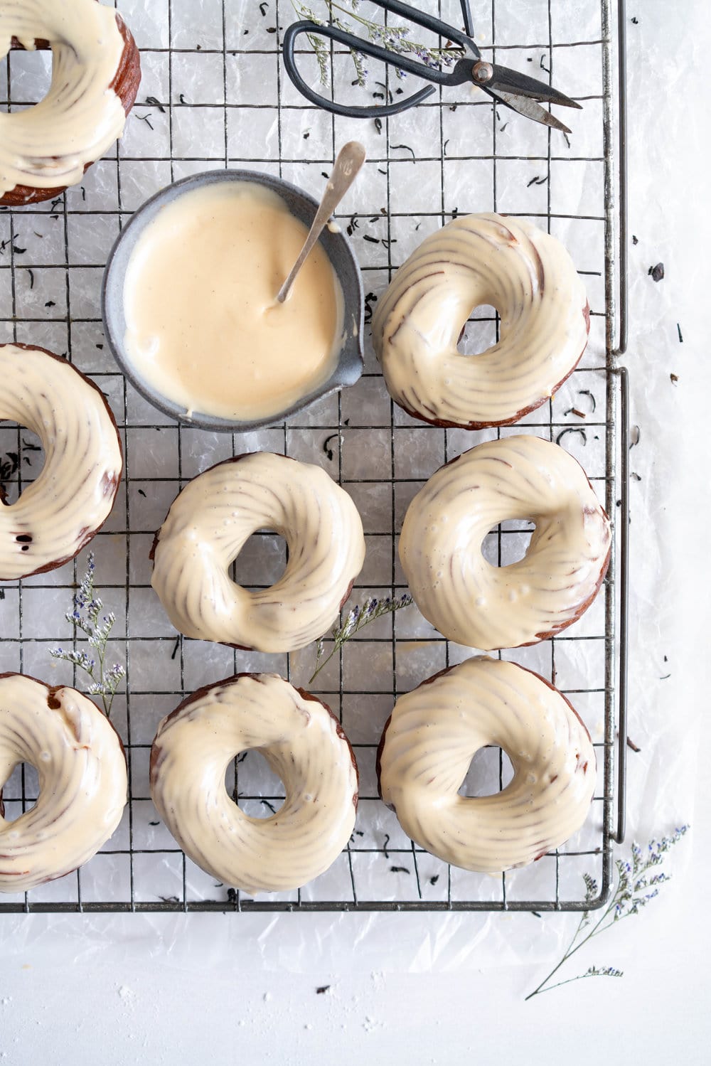 Earl Grey Crullers with Earl Grey Glaze. Perfectly flaky earl grey infused choux pastry is fried into golden brown crullers, then glazed with a delicately flavoured Earl Grey Glaze. #earlgrey #cruller #doughnuts #donuts #baking #fried #choux #chouxpastry