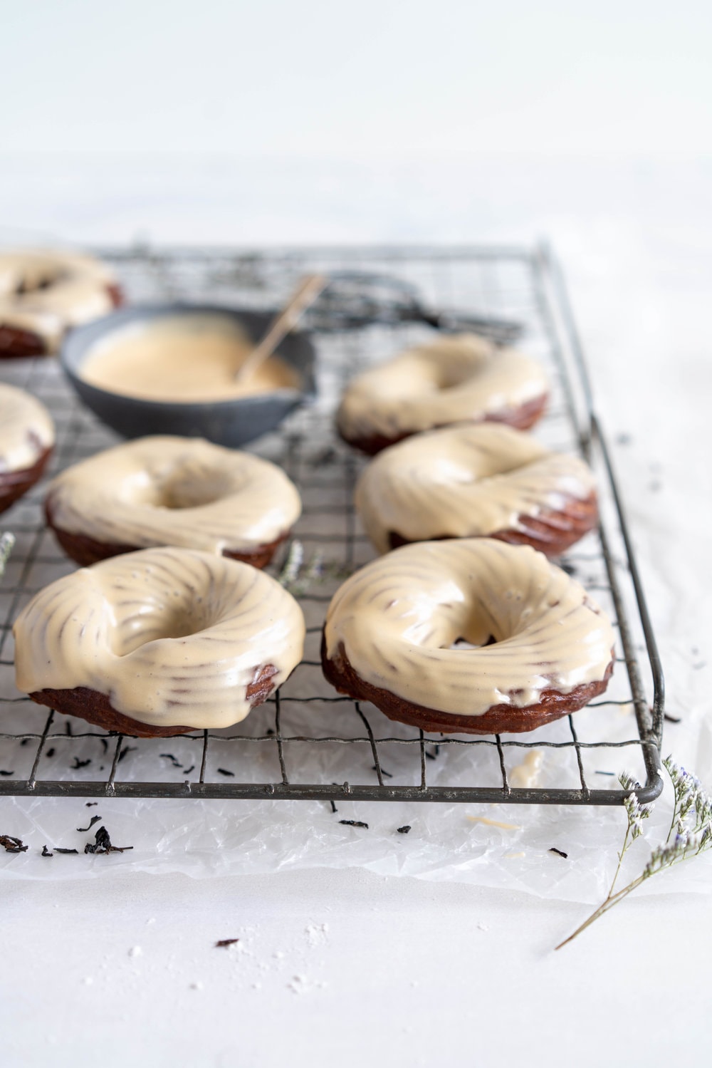 Earl Grey Crullers with Earl Grey Glaze. Perfectly flaky earl grey infused choux pastry is fried into golden brown crullers, then glazed with a delicately flavoured Earl Grey Glaze. #earlgrey #cruller #doughnuts #donuts #baking #fried #choux #chouxpastry