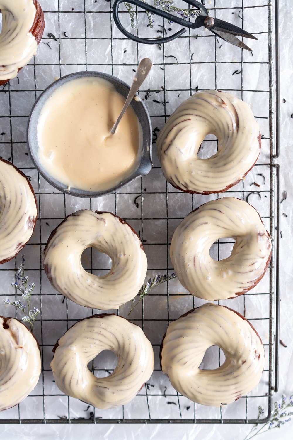 Earl Grey Crullers with Earl Grey Glaze. Perfectly flaky earl grey infused choux pastry is fried into golden brown crullers, then glazed with a delicately flavoured Earl Grey Glaze. #earlgrey #cruller #doughnuts #donuts #baking #fried #choux #chouxpastry
