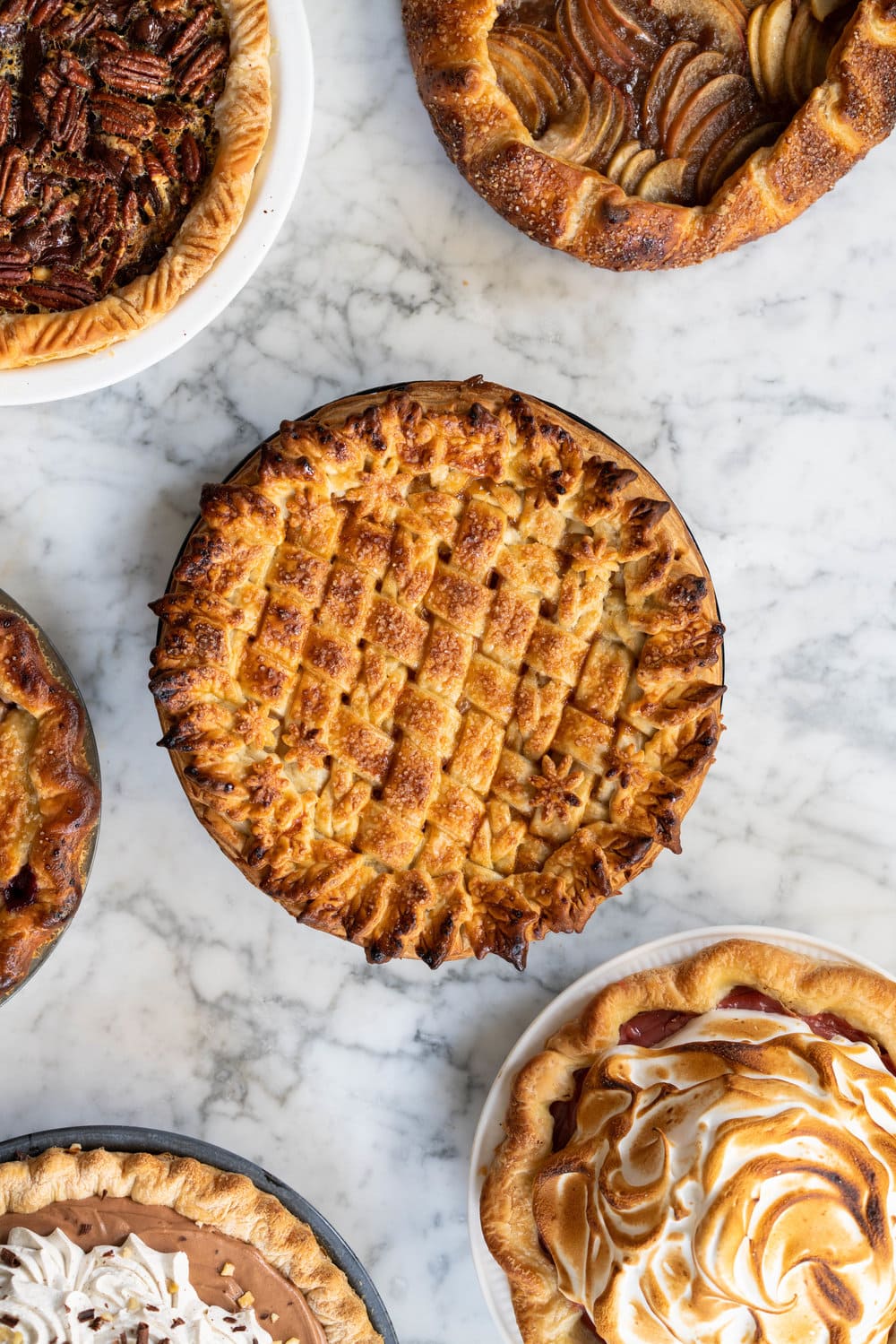 Nine of the Best Thanksgiving Pie Recipes: the Ultimate Pie Roundup Post! This roundup post lists some of the best thanksgiving pie recipes - there is literally something for everyone. Make just one or mix and match for the ultimate thanksgiving pie spread. #thanksgiving #pierecipes #roundup