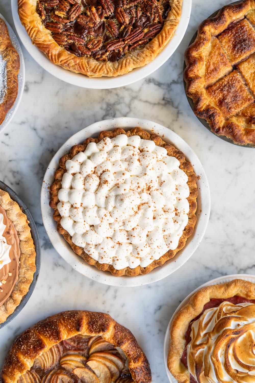 Nine of the Best Thanksgiving Pie Recipes: the Ultimate Pie Roundup Post! This roundup post lists some of the best thanksgiving pie recipes - there is literally something for everyone. Make just one or mix and match for the ultimate thanksgiving pie spread. #thanksgiving #pierecipes #roundup