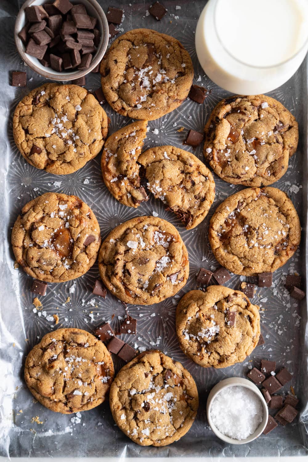 Brown Butter Salted Caramel Chocolate Chunk Cookies. Regular pantry staples are elevated to another level to give this cookie a 'fancy with only a little more effort' vibe. Brown butter is stirred in with toasty muscovado sugar to form a perfect cookie dough, and then hard caramel shards and chocolate chunks are folded in to give the perfect amount of chocolate and caramel per bite. Finished with flaky sea salt, this is a super easy yet satisfying baking recipe. #saltedcaramelcookie #chocolatechunkcookie #brownbutter