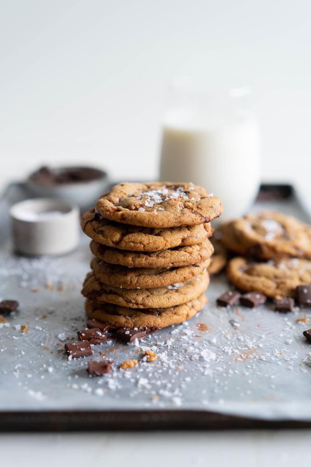 Brown Butter Salted Caramel Chocolate Chunk Cookies. Regular pantry staples are elevated to another level to give this cookie a 'fancy with only a little more effort' vibe. Brown butter is stirred in with toasty muscovado sugar to form a perfect cookie dough, and then hard caramel shards and chocolate chunks are folded in to give the perfect amount of chocolate and caramel per bite. Finished with flaky sea salt, this is a super easy yet satisfying baking recipe. #saltedcaramelcookie #chocolatechunkcookie #brownbutter