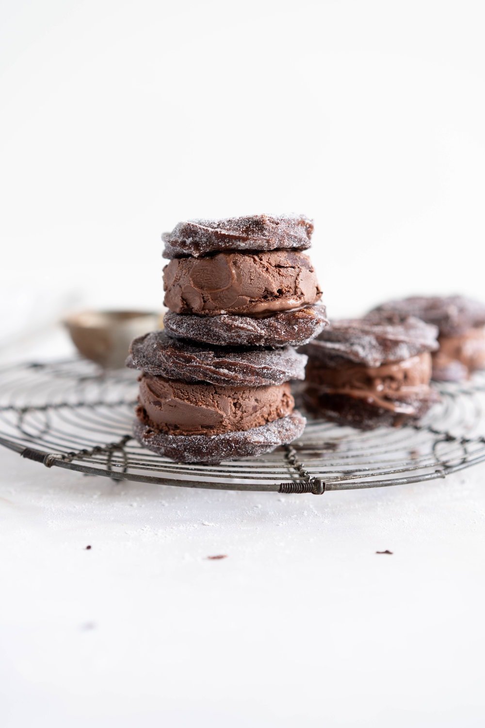 Chocolate Choux Ice Cream Sandwiches with Double Chocolate Ice Cream. The ultimate ice cream sandwich - homemade, rich chocolate ice cream is sandwiched by two light and crispy chocolate choux doughnuts. A simple but indulgent treat. #cruller #icecreamsandwich #choux