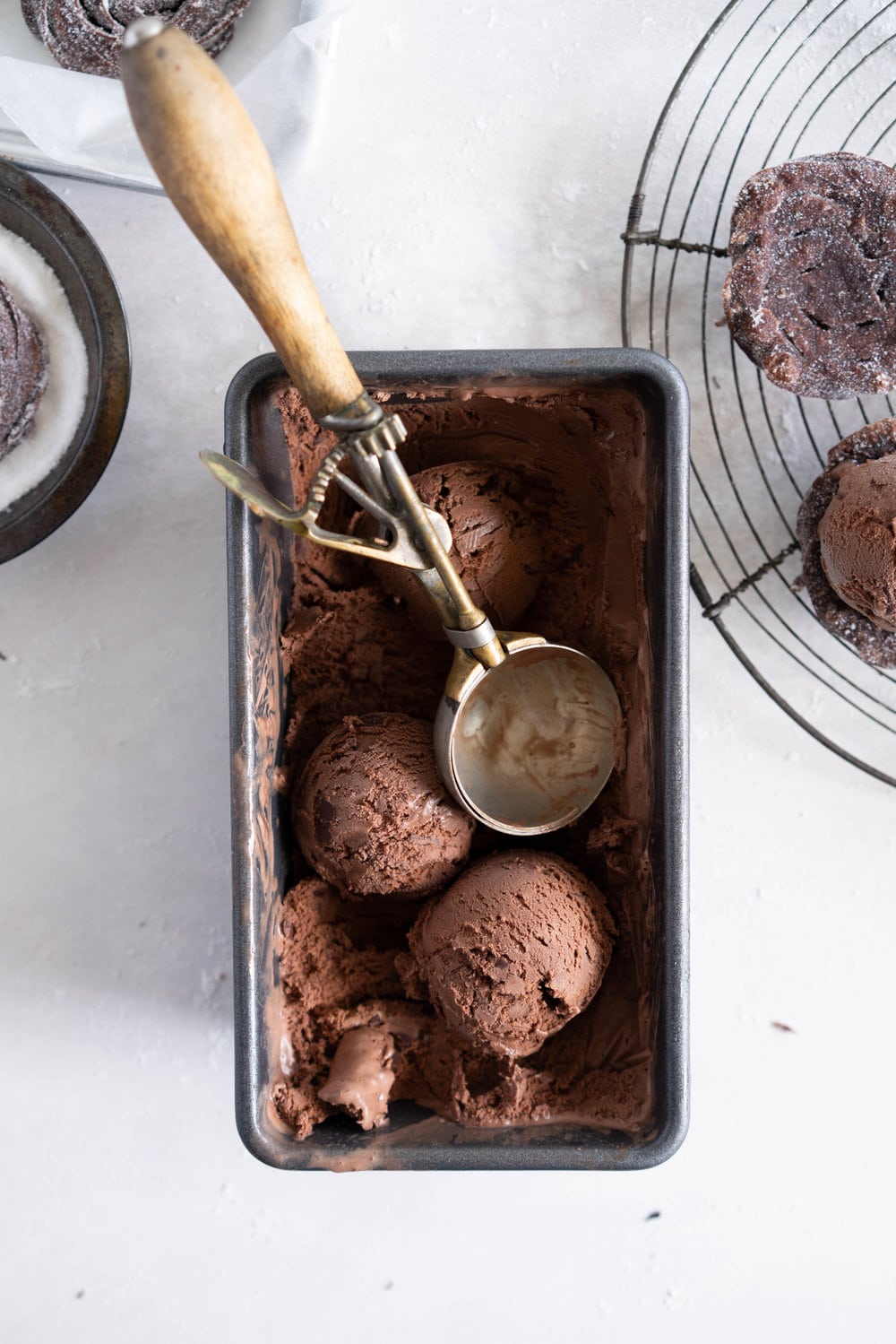 Chocolate Choux Ice Cream Sandwiches with Double Chocolate Ice Cream. The ultimate ice cream sandwich - homemade, rich chocolate ice cream is sandwiched by two light and crispy chocolate choux doughnuts. A simple but indulgent treat. #cruller #icecreamsandwich #choux