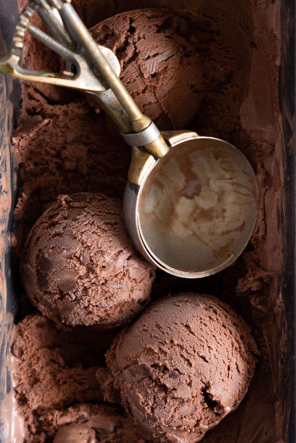 Chocolate Choux Ice Cream Sandwiches with Double Chocolate Ice Cream. The ultimate ice cream sandwich - homemade, rich chocolate ice cream is sandwiched by two light and crispy chocolate choux doughnuts. A simple but indulgent treat. #cruller #icecreamsandwich #choux