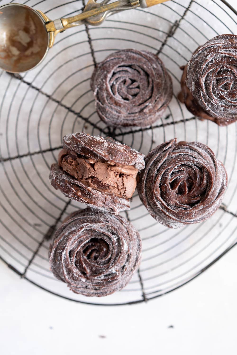 Chocolate Choux Ice Cream Sandwiches with Double Chocolate Ice Cream. The ultimate ice cream sandwich - homemade, rich chocolate ice cream is sandwiched by two light and crispy chocolate choux doughnuts. A simple but indulgent treat. #cruller #icecreamsandwich #choux