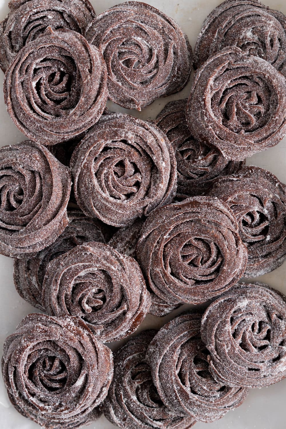 Chocolate Choux Ice Cream Sandwiches with Double Chocolate Ice Cream. The ultimate ice cream sandwich - homemade, rich chocolate ice cream is sandwiched by two light and crispy chocolate choux doughnuts. A simple but indulgent treat. #cruller #icecreamsandwich #choux