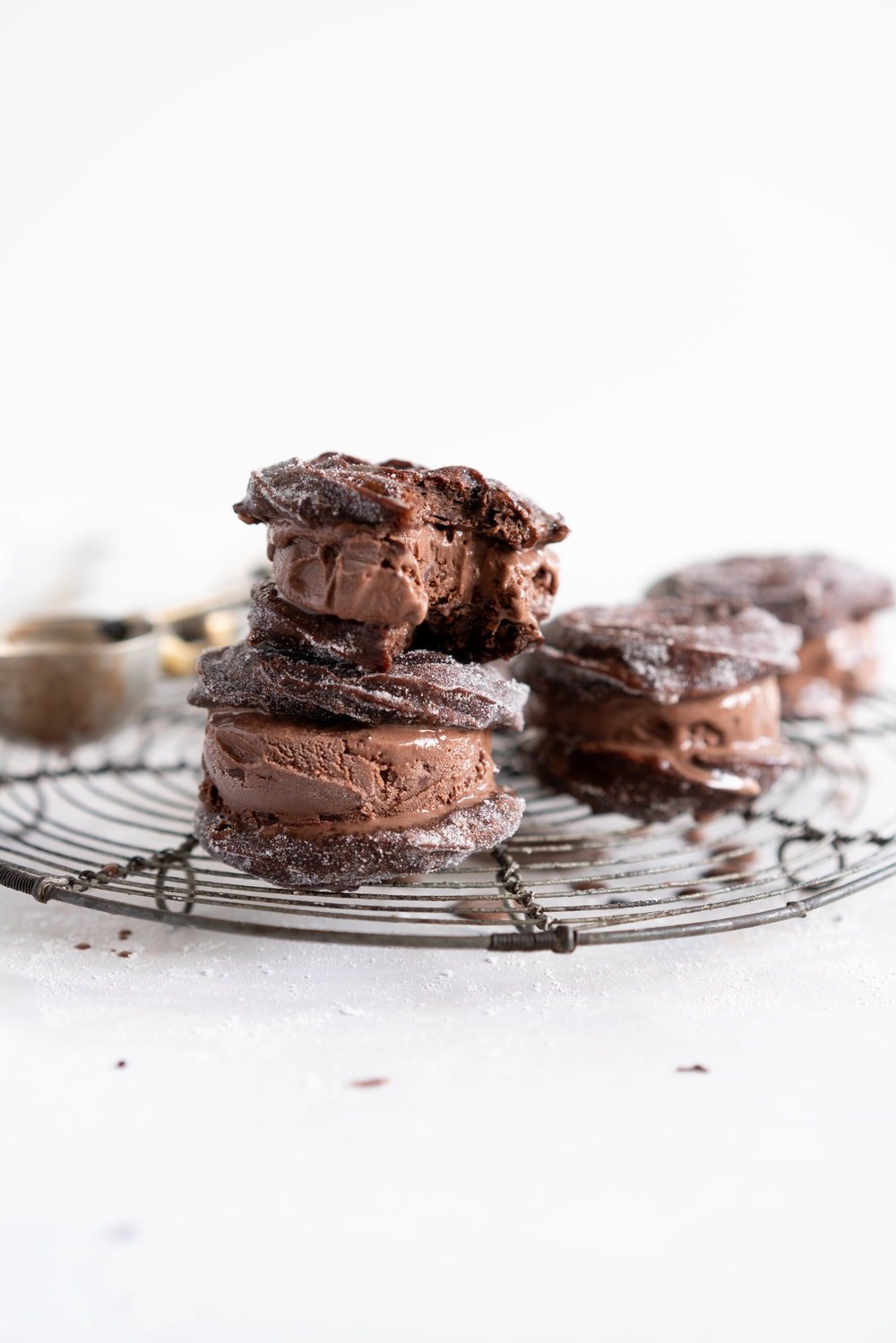 Chocolate Choux Ice Cream Sandwiches with Double Chocolate Ice Cream. The ultimate ice cream sandwich - homemade, rich chocolate ice cream is sandwiched by two light and crispy chocolate choux doughnuts. A simple but indulgent treat. #cruller #icecreamsandwich #choux