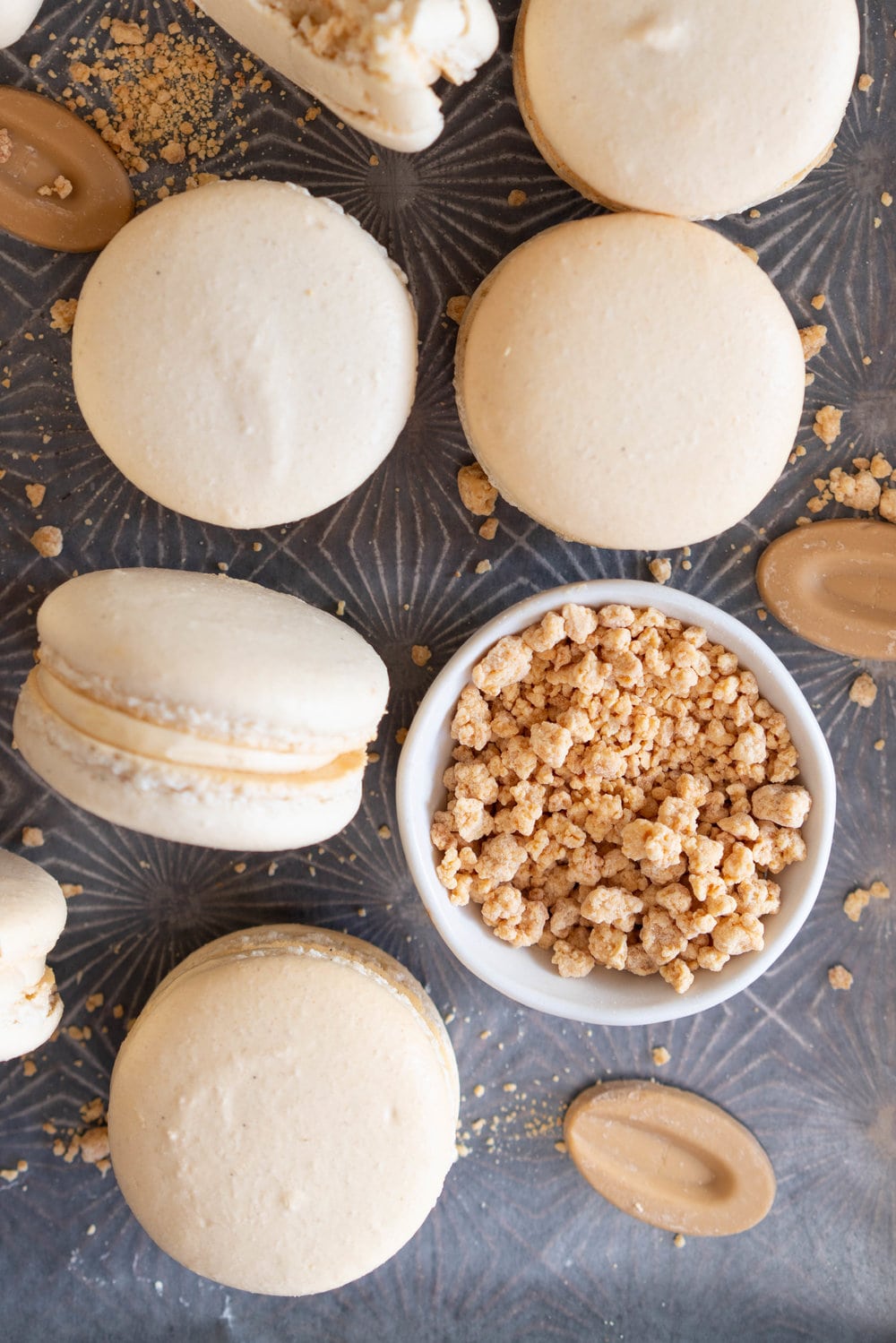 Toasted Sugar Vanilla Bean Macaron shells are sandwiched with a silky, creamy German buttercream loaded with caramelised white chocolate, Subtle elevated flavours makes this a perfect simple recipe that is sure to wow your friends or make the perfect treat or gift. #frenchmacaron #macaronrecipe