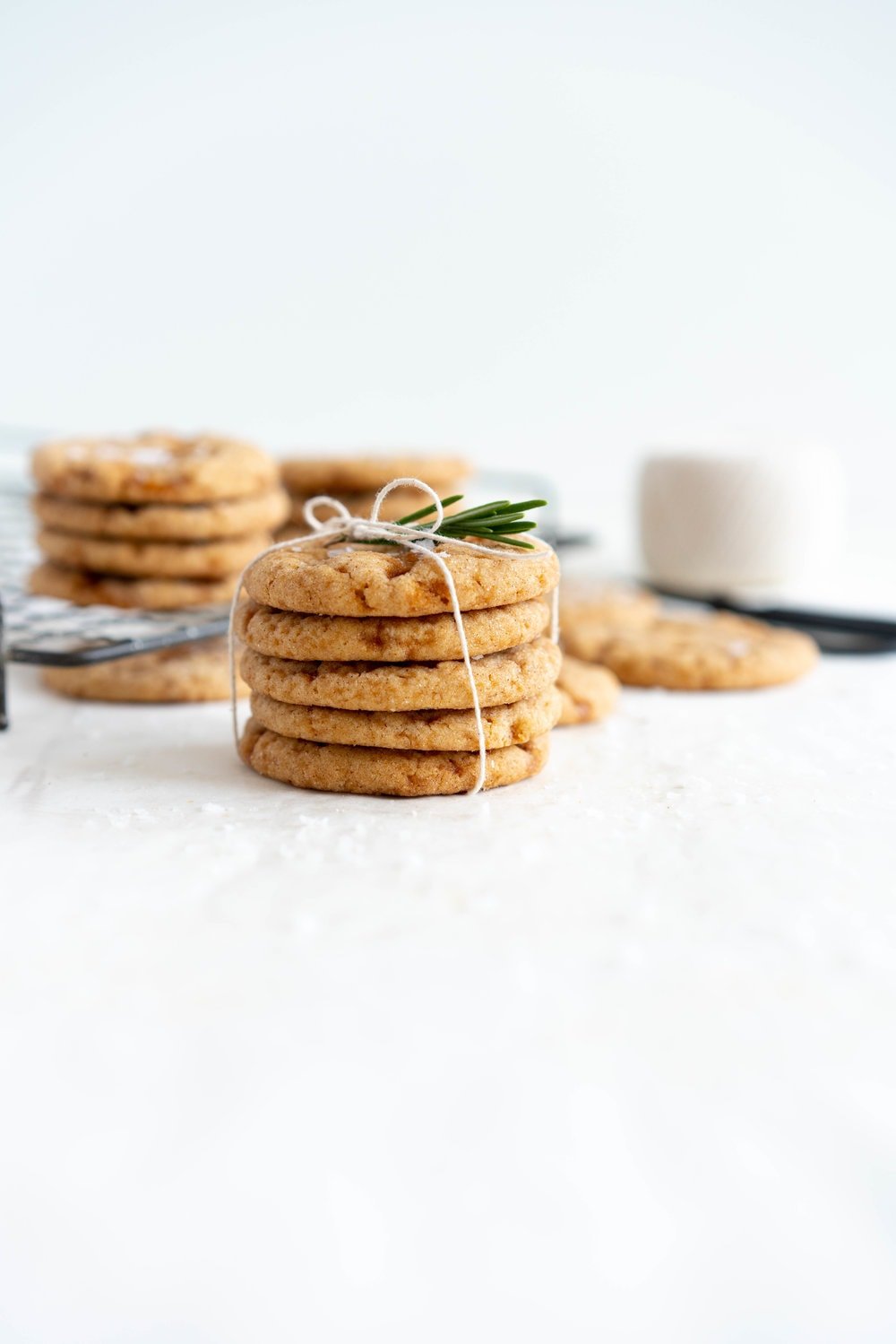 Salted caramel snickerdoodles - hard caramel is ground up and mixed into the cookie dough, then chunks of caramel are folded through to form chewy pockets once the cookie has baked. The perfect crowd pleasing christmas cookie.