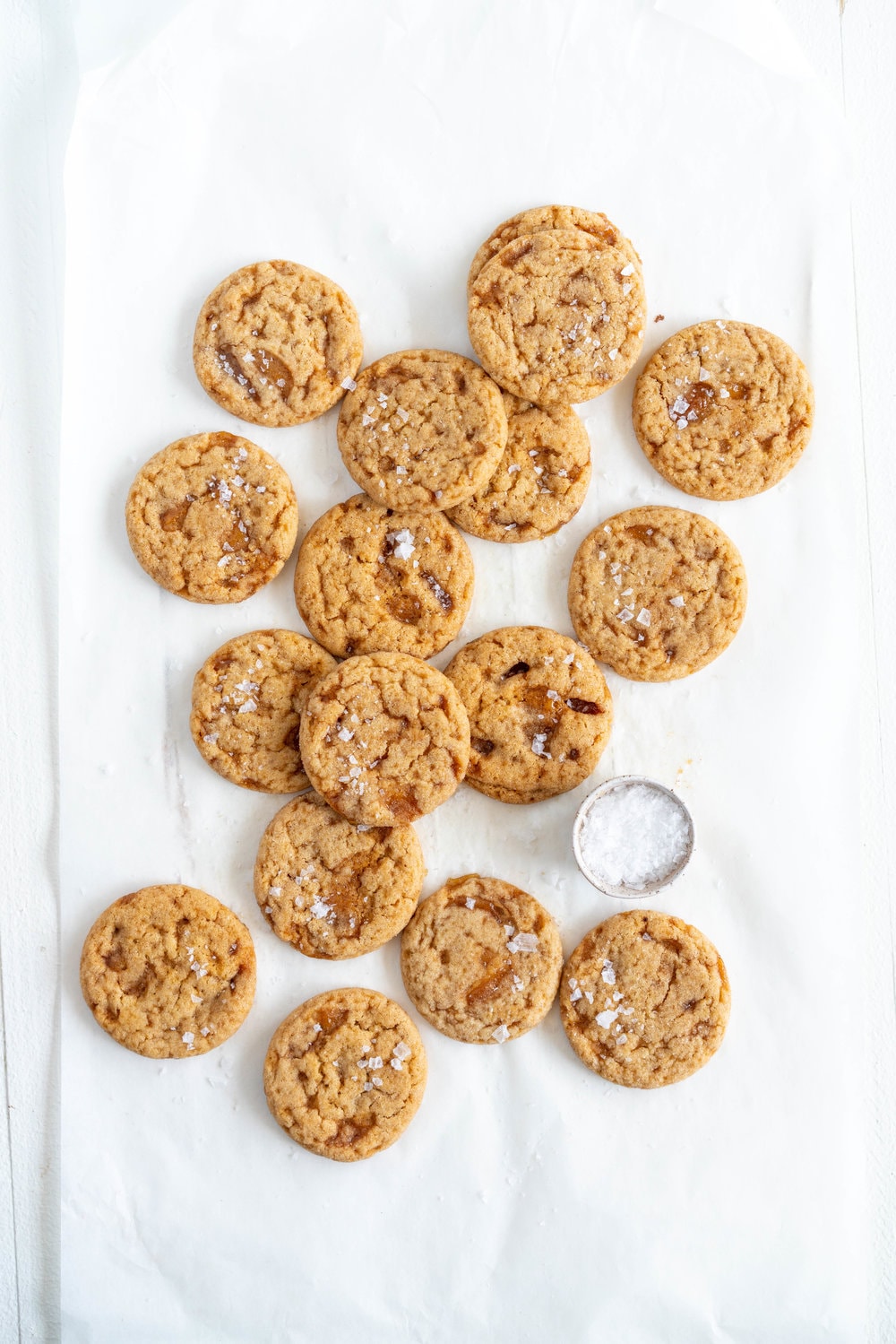 Salted caramel snickerdoodles - hard caramel is ground up and mixed into the cookie dough, then chunks of caramel are folded through to form chewy pockets once the cookie has baked. The perfect crowd pleasing christmas cookie.