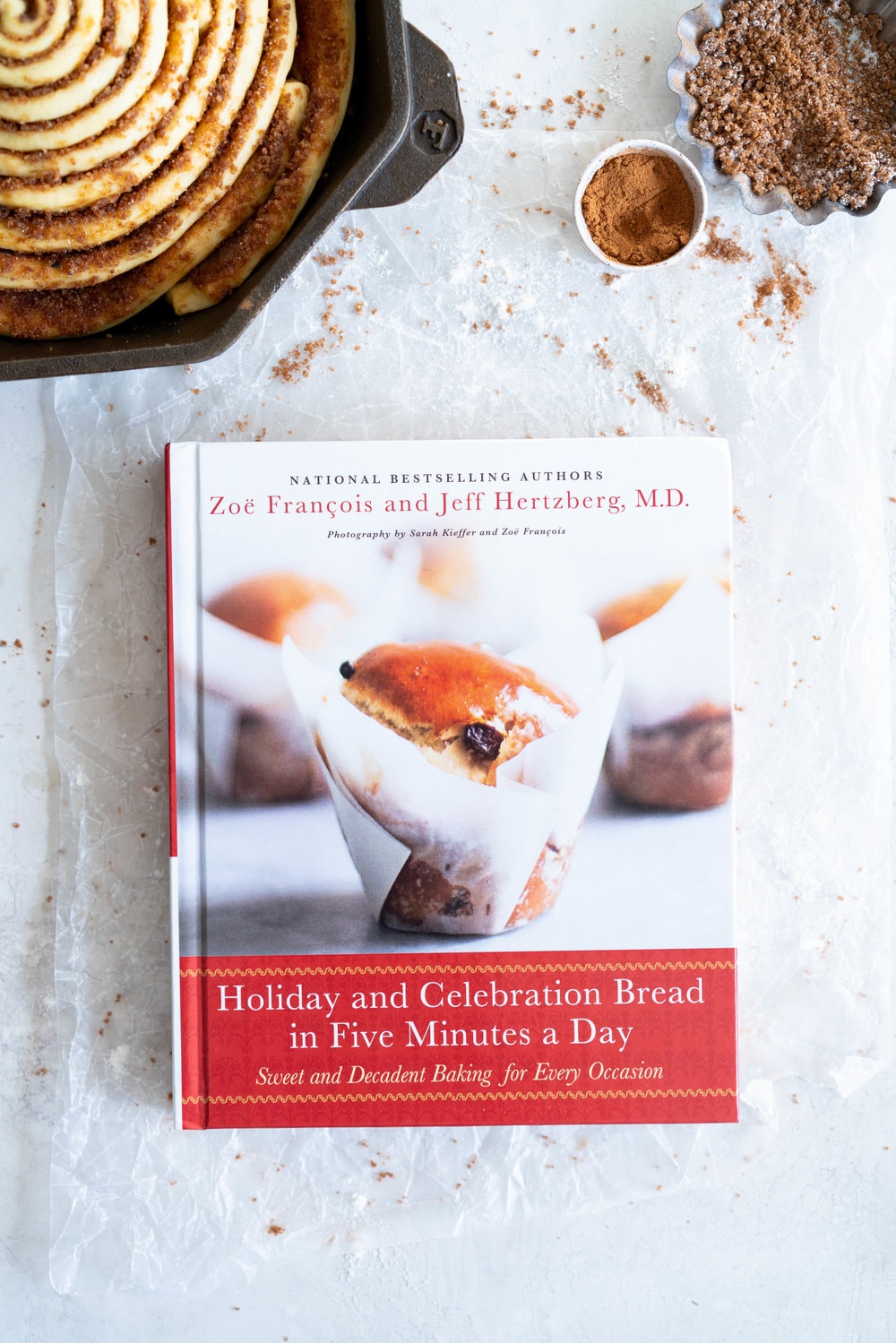 Giant Skillet Cinnamon Roll with Cream Cheese Icing - from Holiday and Celebration bread in five minutes a day. No knead brioche is covered in cinnamon sugar and rolled into a giant cinnamon roll - the most amazing twist on the traditional roll, and perfect for Christmas morning.