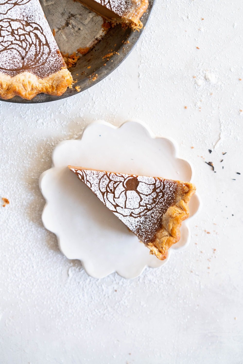 Earl Grey Sugar Pie - Fragrant Earl grey custard is spiked with vanilla bean, and finished with a hefty dusting of powdered sugar. An egg free version of a custard favourite that bakes perfectly flat and will never crack on you.