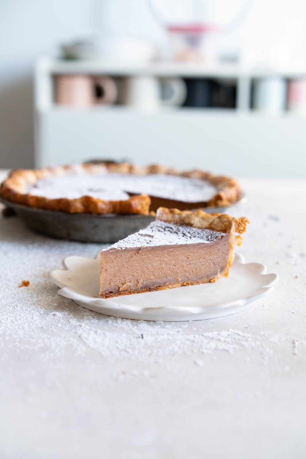 Earl Grey Sugar Pie - Fragrant Earl grey custard is spiked with vanilla bean, and finished with a hefty dusting of powdered sugar. An egg free version of a custard favourite that bakes perfectly flat and will never crack on you.
