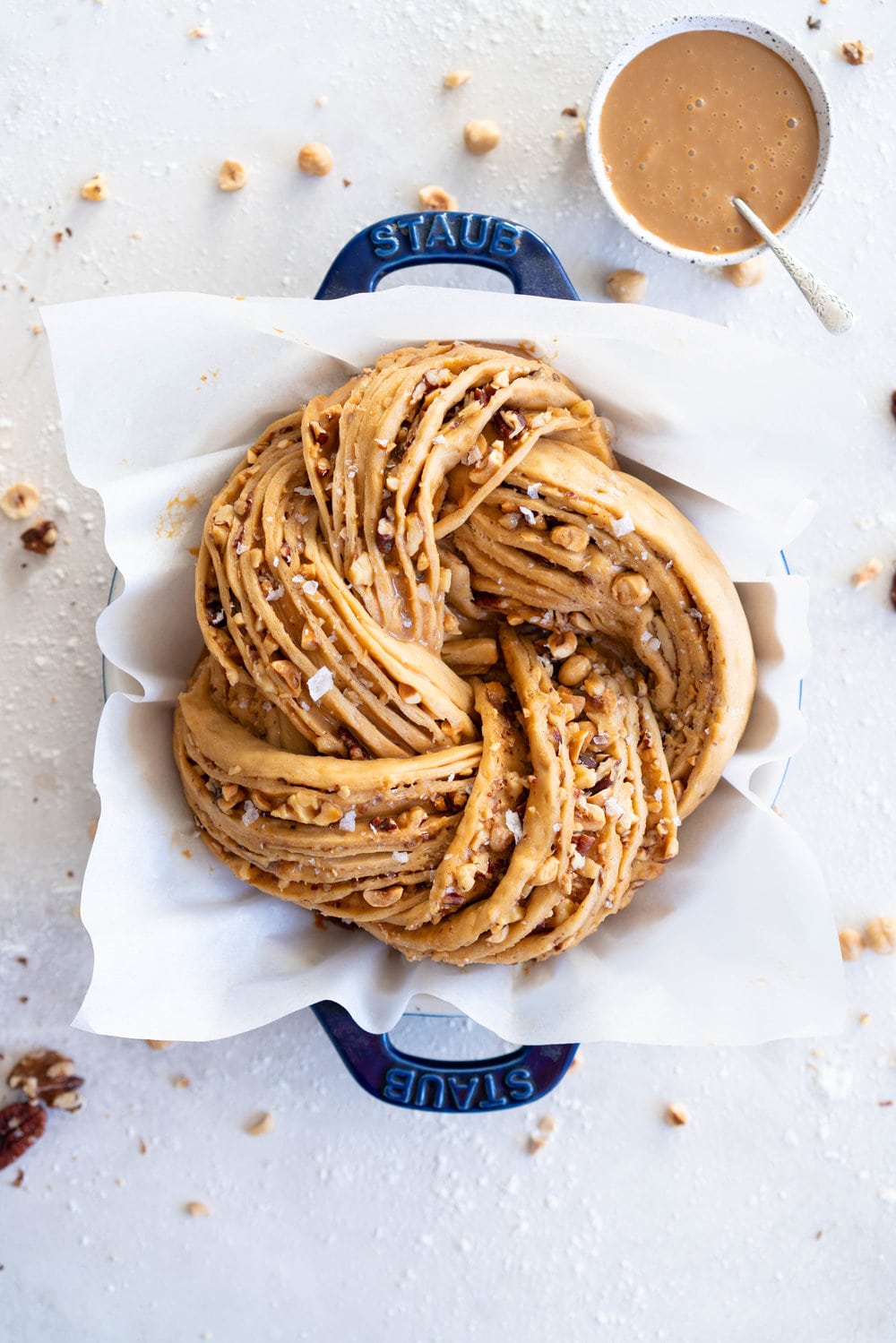 Brioche dough is spiked with vanilla bean and muscovado sugar, and spread with dulce de leche and sprinkled with mixed nuts. The finished knot is dusted with powdered sugar - the perfect christmas treat to feed a crowd.