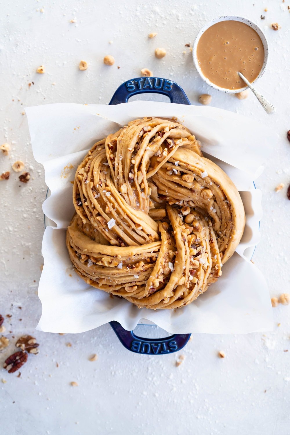 Brioche dough is spiked with vanilla bean and muscovado sugar, and spread with dulce de leche and sprinkled with mixed nuts. The finished knot is dusted with powdered sugar - the perfect christmas treat to feed a crowd.