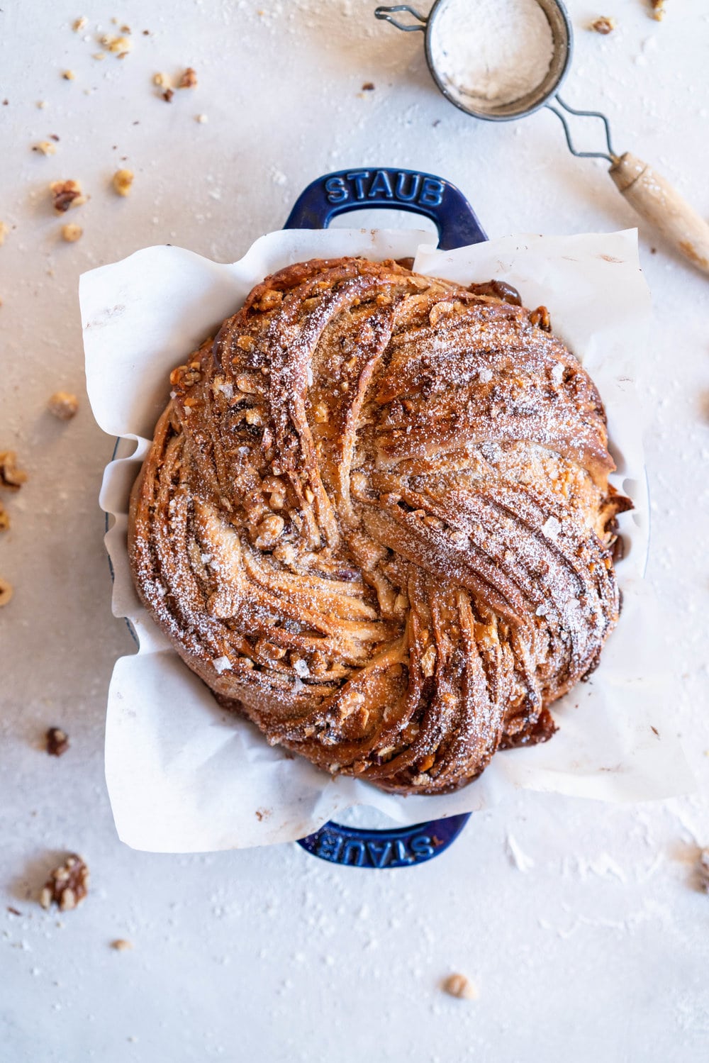 Brioche dough is spiked with vanilla bean and muscovado sugar, and spread with dulce de leche and sprinkled with mixed nuts. The finished knot is dusted with powdered sugar - the perfect christmas treat to feed a crowd.