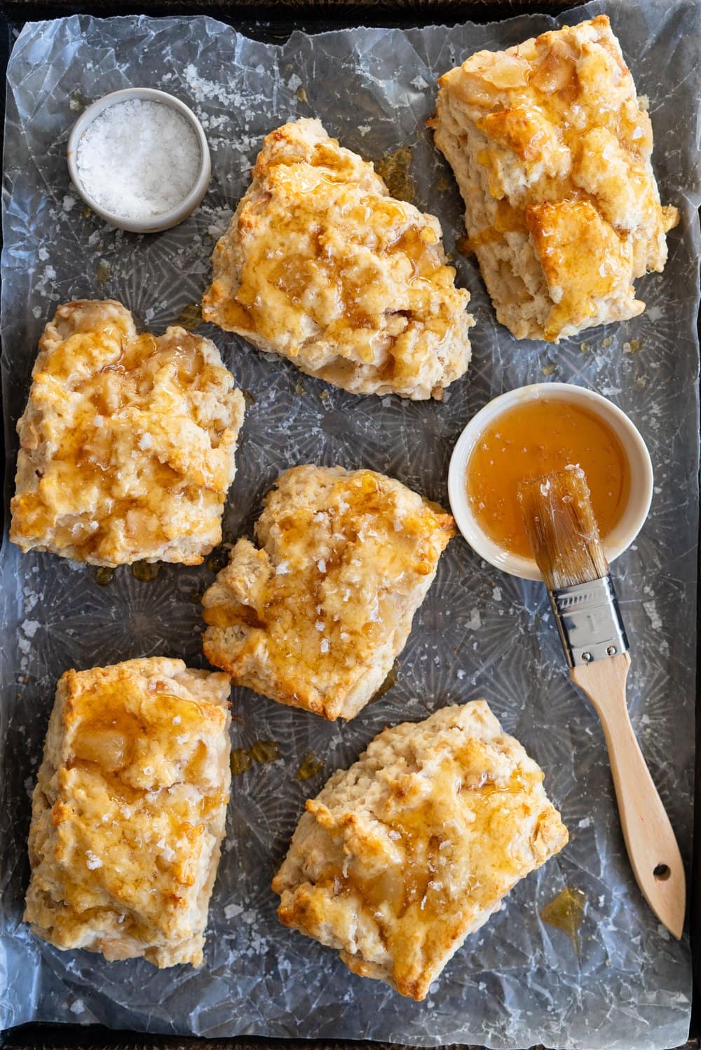 Roasted Pear and Vanilla Bean Scones with Salty Honey Glaze - Giant Craggy Scones filled with pear chunks held together with tender scone dough, and finished with a sticky honey glaze and a generous dose of flaky sea salt.