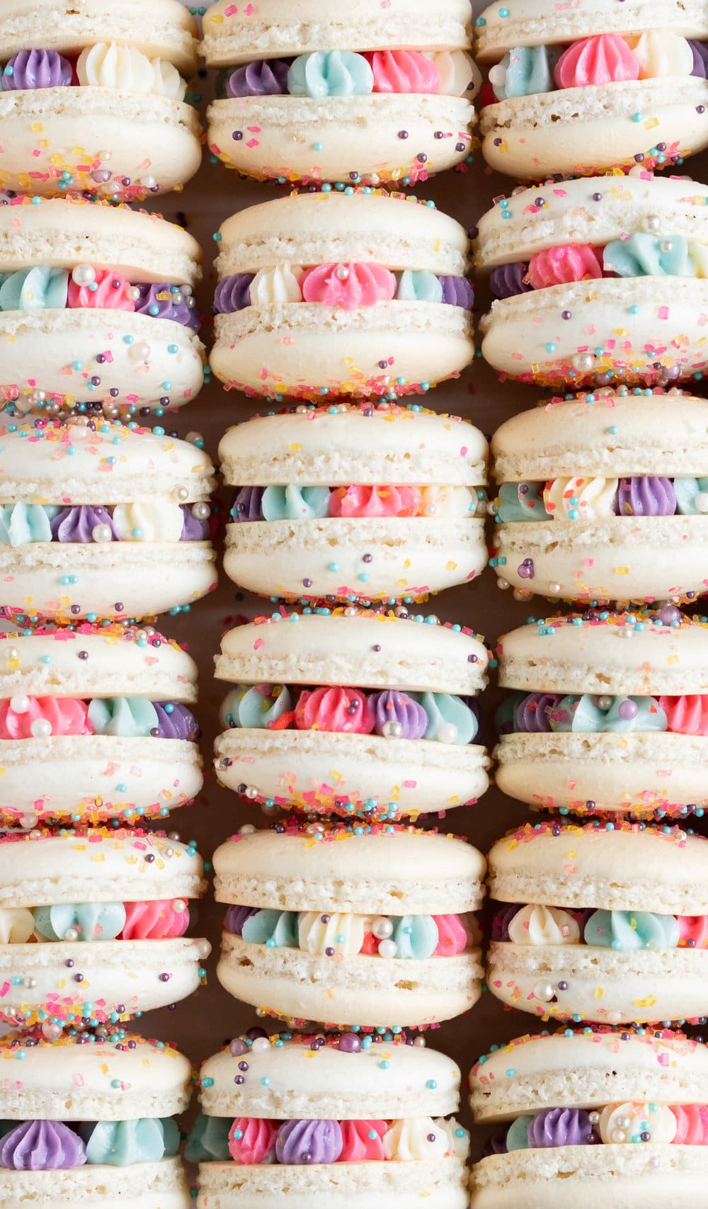 New Year's Macarons with Vanilla Bean Swiss Meringue Buttercream and Pop Rocks. Light, sparkly, and perfect for ringing in the new year.