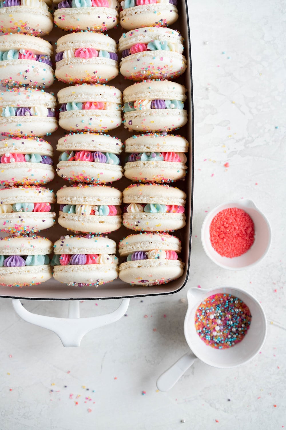 New Year's Macarons with Vanilla Bean Swiss Meringue Buttercream and Pop Rocks. Light, sparkly, and perfect for ringing in the new year.