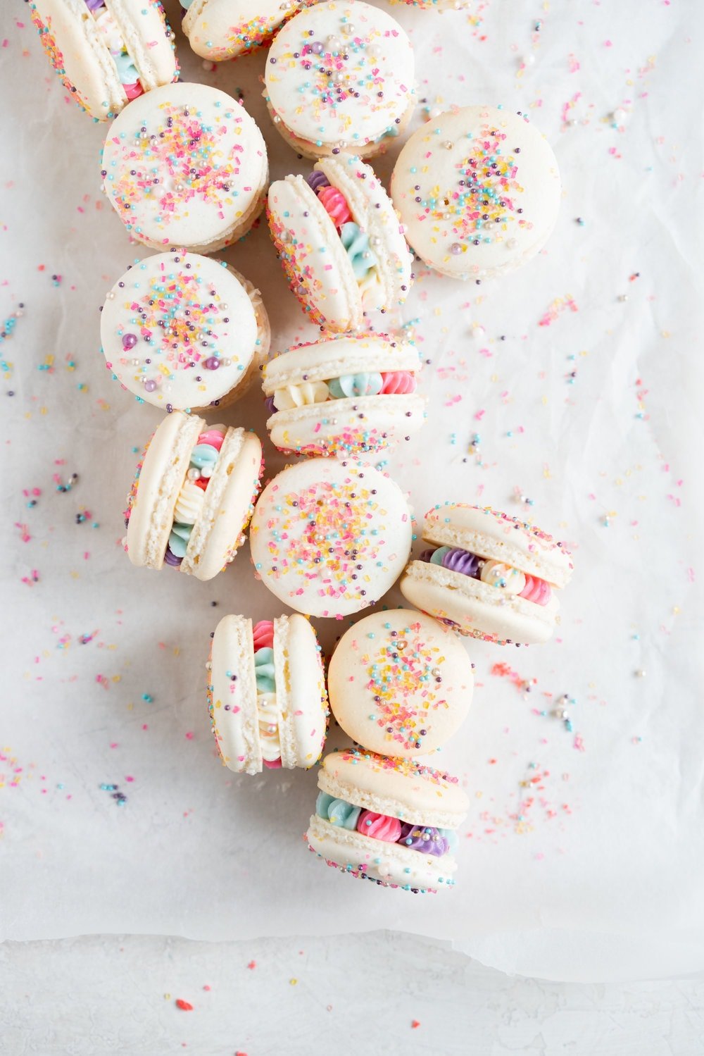 New Year's Macarons with Vanilla Bean Swiss Meringue Buttercream and Pop Rocks. Light, sparkly, and perfect for ringing in the new year.