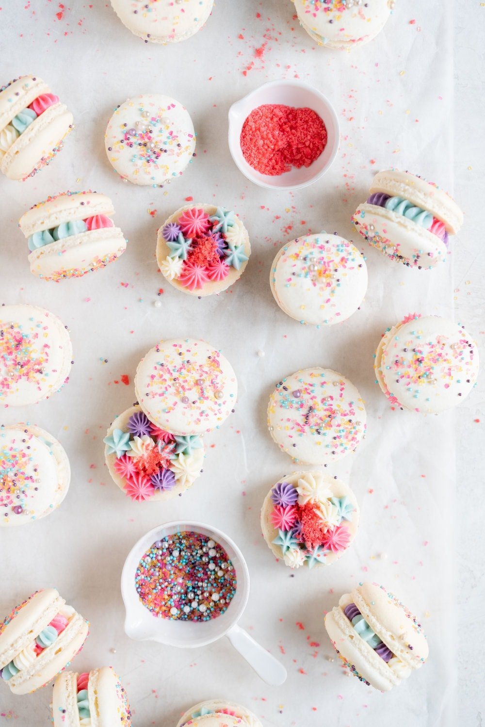 New Year's Macarons with Vanilla Bean Swiss Meringue Buttercream and Pop Rocks. Light, sparkly, and perfect for ringing in the new year.