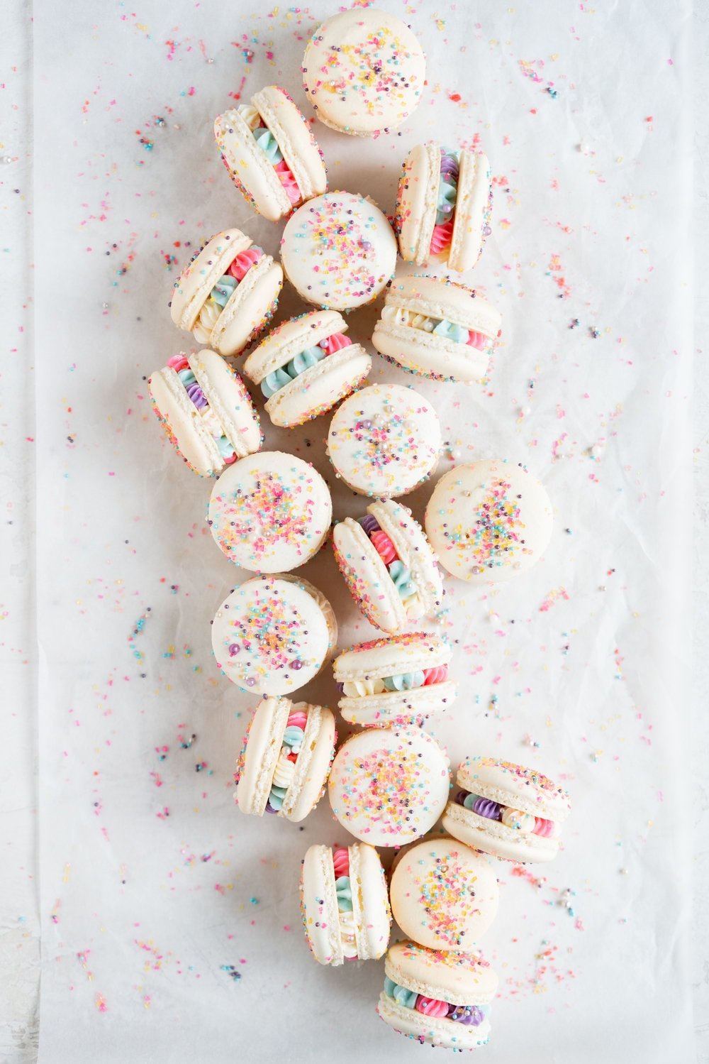 New Year's Macarons with Vanilla Bean Swiss Meringue Buttercream and Pop Rocks. Light, sparkly, and perfect for ringing in the new year.