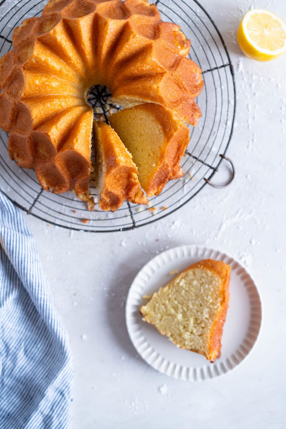 Olive Oil, Lemon, and Yoghurt Bundt Cake - a simple cake which comes together in two bowls, no fancy equipment required. Perfectly dense, flavoured with tangy greek yoghurt and floral, fruity olive oil. the perfect cake for any occasion. #bundtcake #lemonbundt