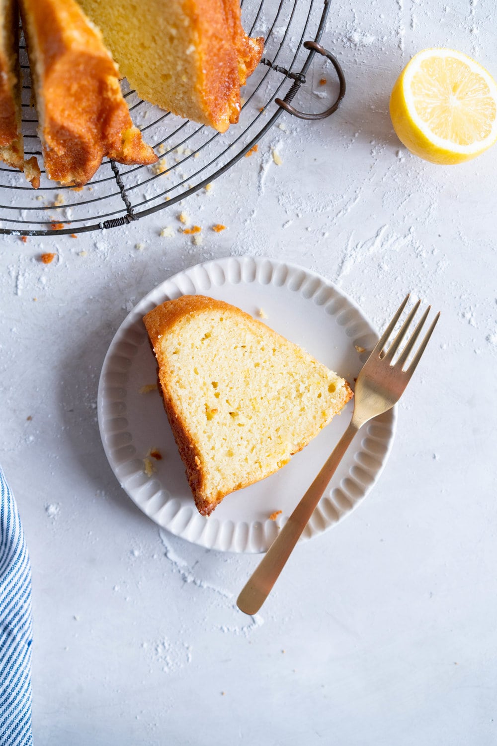 Olive Oil, Lemon, and Yoghurt Bundt Cake - a simple cake which comes together in two bowls, no fancy equipment required. Perfectly dense, flavoured with tangy greek yoghurt and floral, fruity olive oil. the perfect cake for any occasion. #bundtcake #lemonbundt