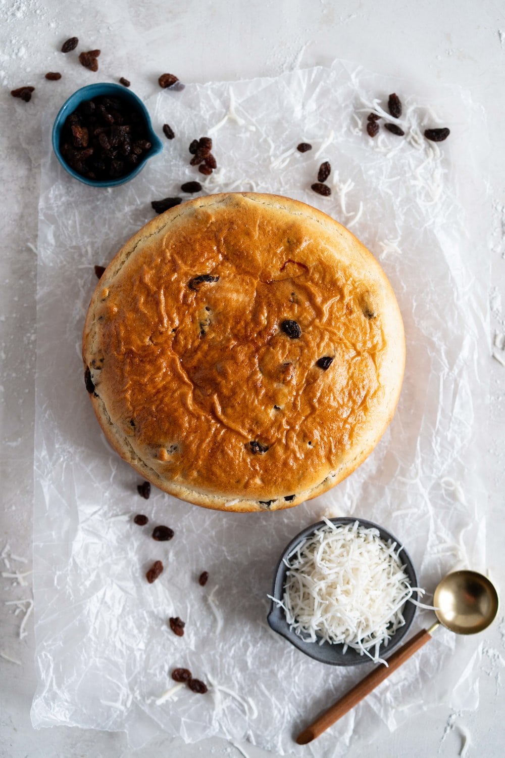 Boston Bun is a raisin brioche bun, covered with vanilla icing, and finished with shredded coconut. It is super easy to make, requires no fancy equipment or dough twisting, and makes the perfect treat with a cup of coffee or to entertain guests. #bostonbun #sallylunn #raisinbrioche
