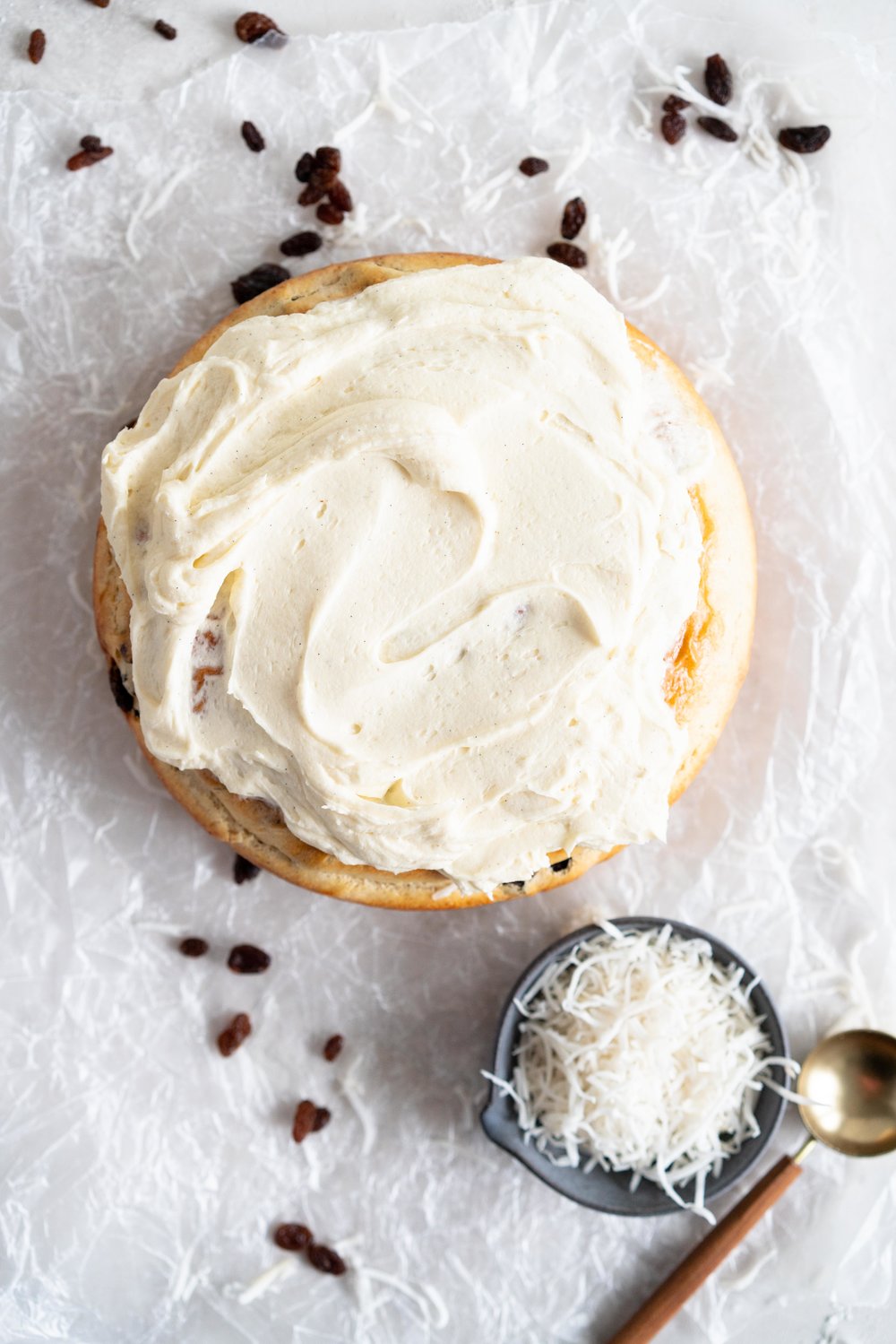 Boston Bun is a raisin brioche bun, covered with vanilla icing, and finished with shredded coconut. It is super easy to make, requires no fancy equipment or dough twisting, and makes the perfect treat with a cup of coffee or to entertain guests. #bostonbun #sallylunn #raisinbrioche