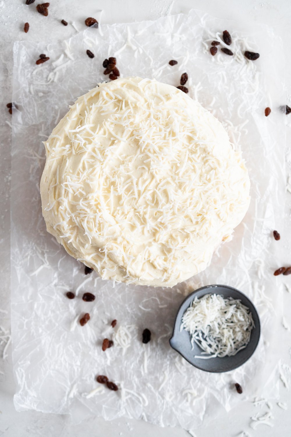Boston Bun is a raisin brioche bun, covered with vanilla icing, and finished with shredded coconut. It is super easy to make, requires no fancy equipment or dough twisting, and makes the perfect treat with a cup of coffee or to entertain guests. #bostonbun #sallylunn #raisinbrioche