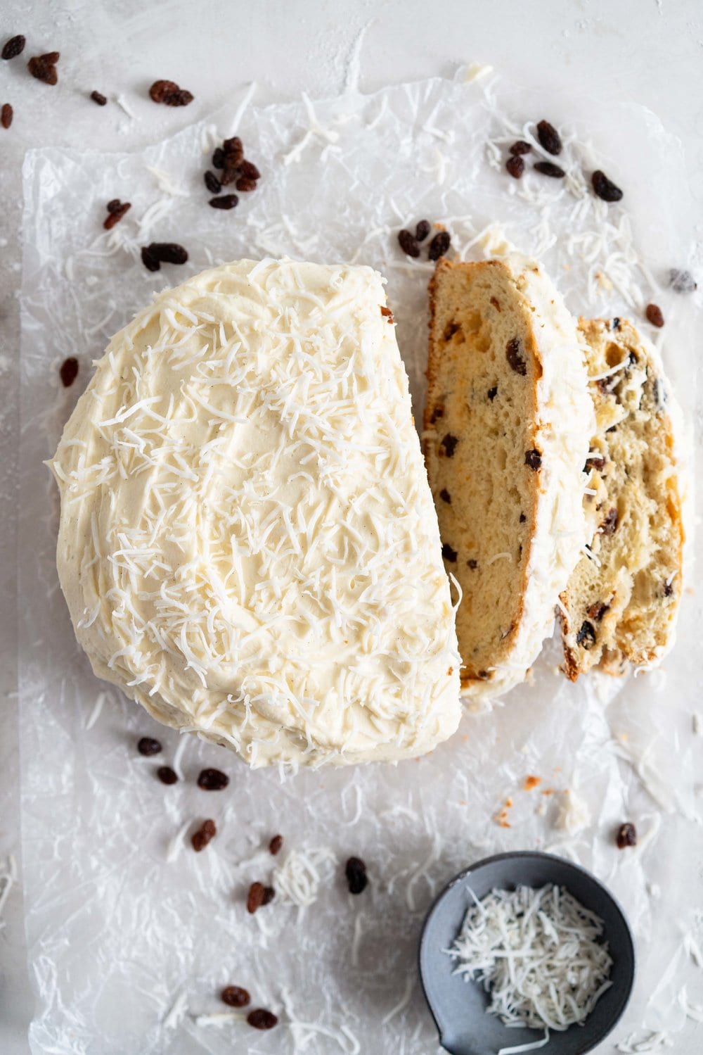 Boston Bun is a raisin brioche bun, covered with vanilla icing, and finished with shredded coconut. It is super easy to make, requires no fancy equipment or dough twisting, and makes the perfect treat with a cup of coffee or to entertain guests. #bostonbun #sallylunn #raisinbrioche