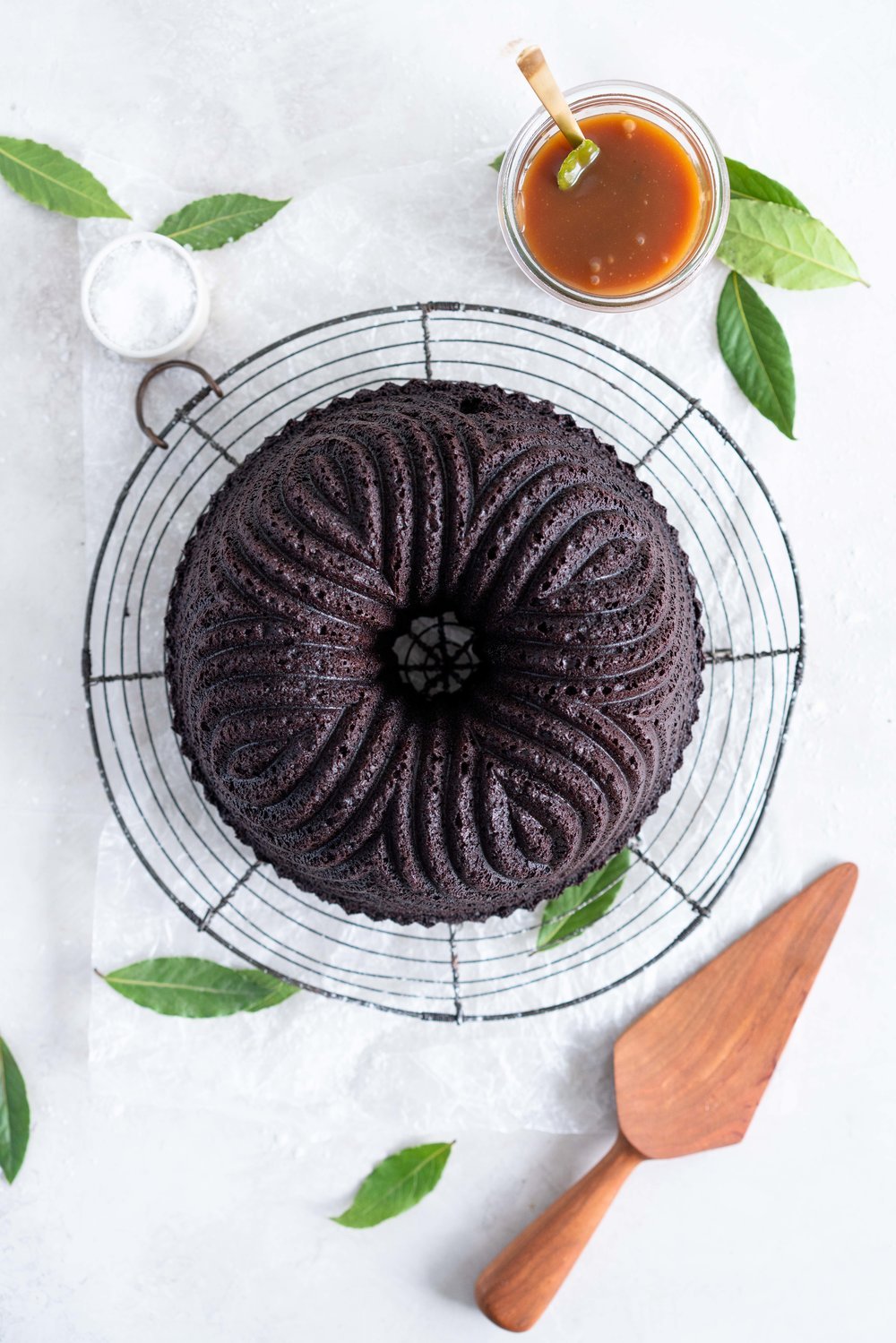One Bowl Devil's food bundt cake with bay leaf caramel - a dense, moist chocolate bundt cake is loaded up with a lightly infused bay caramel. The cake is amazing alone, but with the caramel it is the perfect match. #devilsfoodcake #chocolatebundtcake #baycaramel