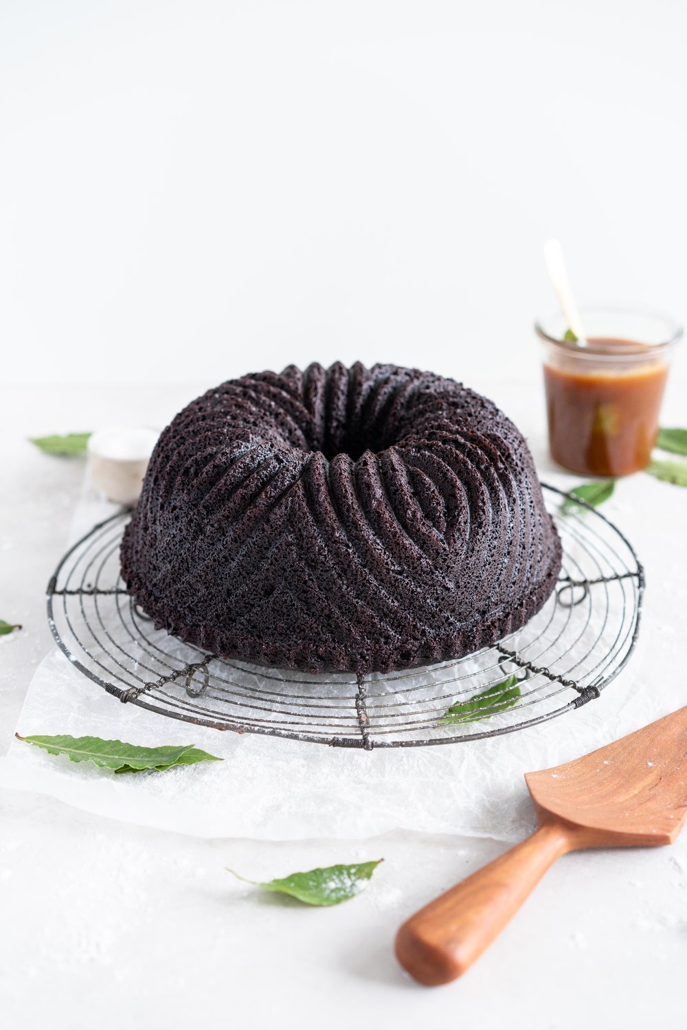 One Bowl Devil's food bundt cake with bay leaf caramel - a dense, moist chocolate bundt cake is loaded up with a lightly infused bay caramel. The cake is amazing alone, but with the caramel it is the perfect match. #devilsfoodcake #chocolatebundtcake #baycaramel