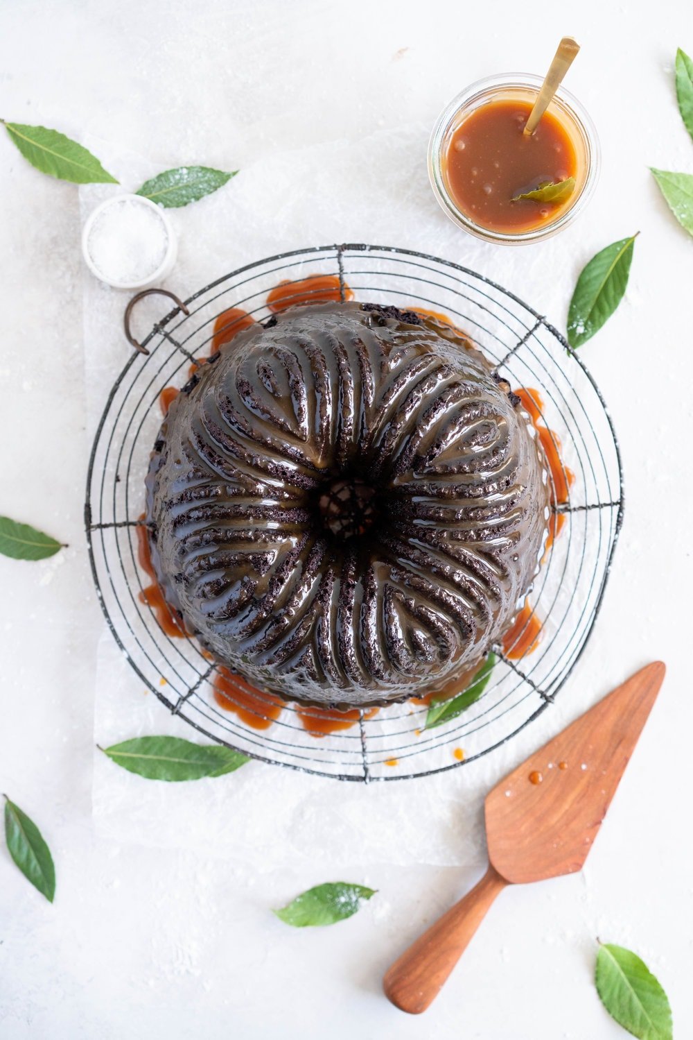 One Bowl Devil's food bundt cake with bay leaf caramel - a dense, moist chocolate bundt cake is loaded up with a lightly infused bay caramel. The cake is amazing alone, but with the caramel it is the perfect match. #devilsfoodcake #chocolatebundtcake #baycaramel