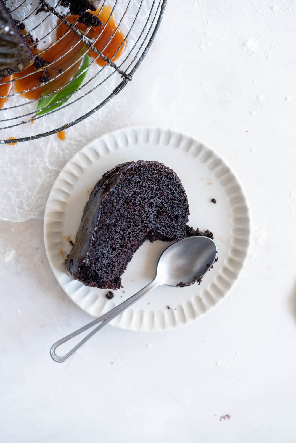 One Bowl Devil's food bundt cake with bay leaf caramel - a dense, moist chocolate bundt cake is loaded up with a lightly infused bay caramel. The cake is amazing alone, but with the caramel it is the perfect match. #devilsfoodcake #chocolatebundtcake #baycaramel