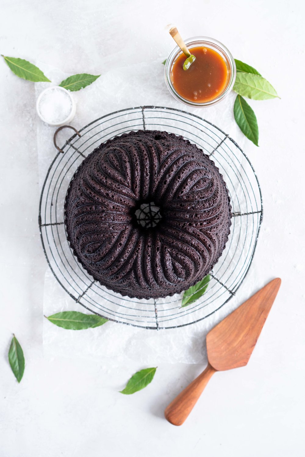 One Bowl Devil's food bundt cake with bay leaf caramel - a dense, moist chocolate bundt cake is loaded up with a lightly infused bay caramel. The cake is amazing alone, but with the caramel it is the perfect match. #devilsfoodcake #chocolatebundtcake #baycaramel