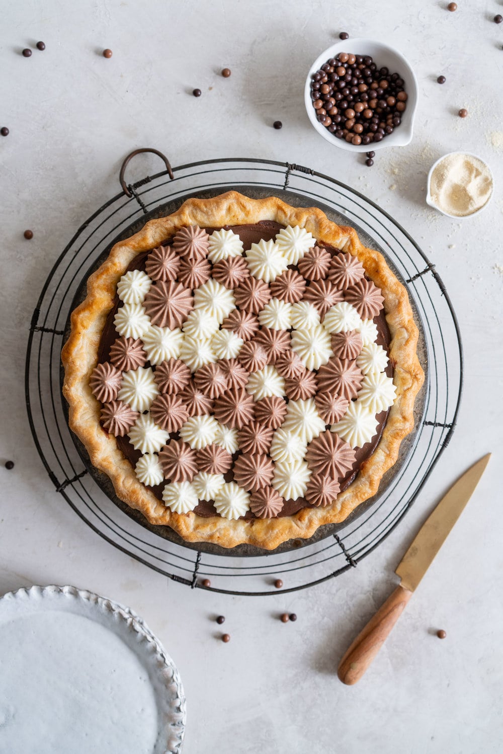 Malted Dark Chocolate Cream Pie with Cream Cheese Whip. A flaky pie crust is topped with a silky malted dark chocolate pudding, and topped with a chocolate and vanilla bean piped cream cheese whipped cream. #creamcheese #chocolatepie #maltedmilk