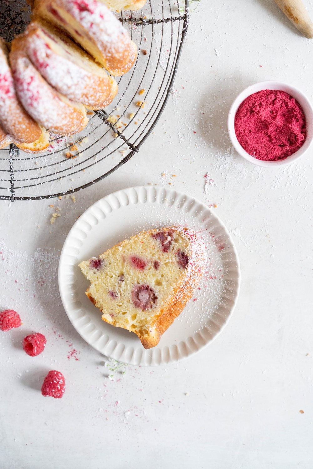Raspberry Ricotta bundt cake - a tender vanilla bean bundt cake is accented with tart raspberries. This easy, stir together cake is the perfect texture, is simple to put together, and is perfect for feeding a crowd. #bundtcake #ricottacake #raspberrybundt