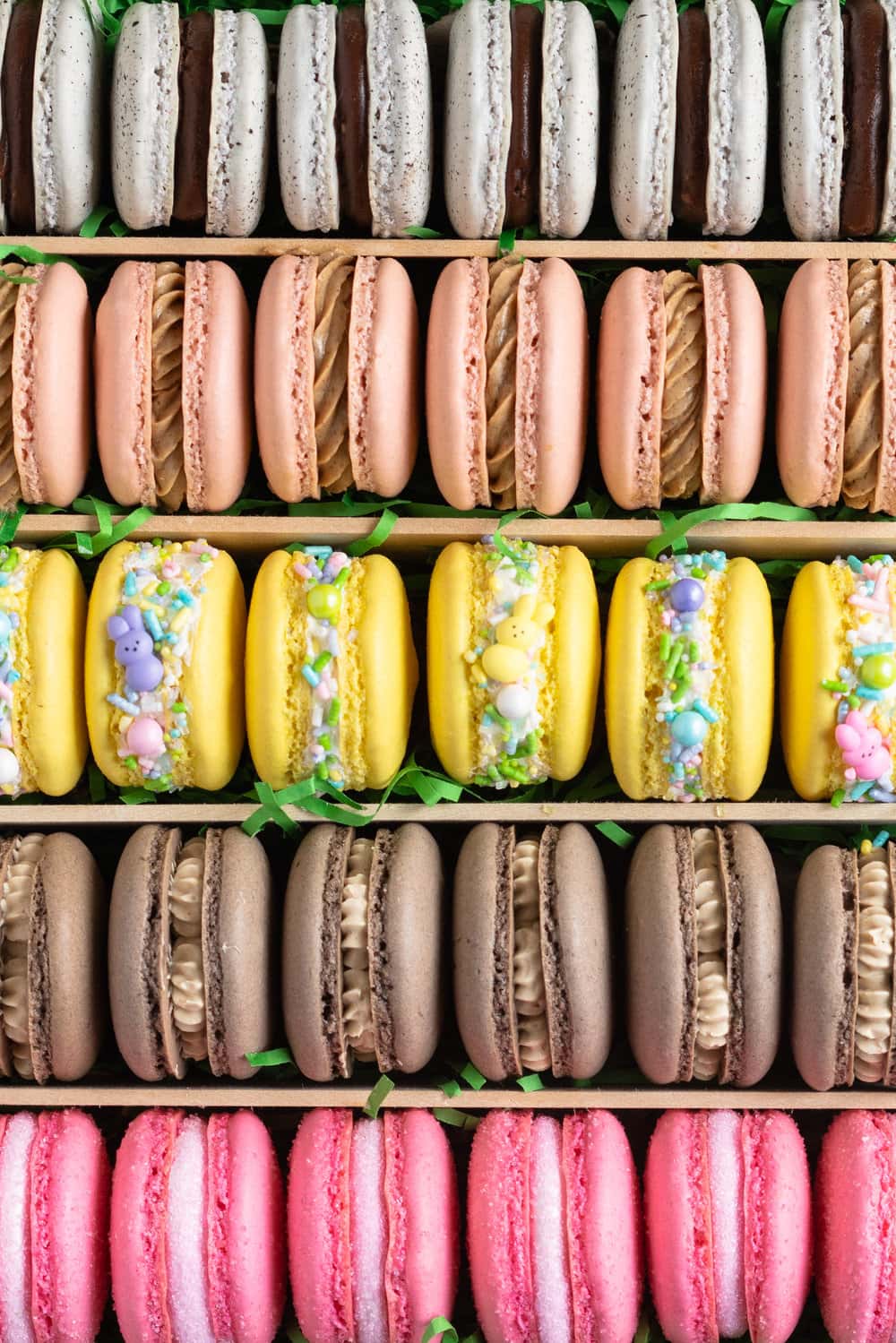 The ultimate Easter Macaron Box - creme egg macarons, hot cross bun macarons, coconut macarons, chocolate peanut butter macarons and peeps marshmallow macarons make up the most amazing Easter inspired box. This would make an incredible easter gift, and can be customised however you like!
