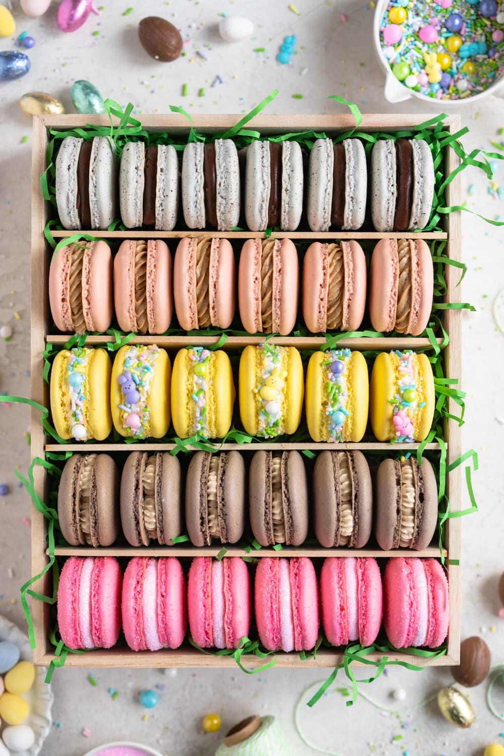 The ultimate Easter Macaron Box - creme egg macarons, hot cross bun macarons, coconut macarons, chocolate peanut butter macarons and peeps marshmallow macarons make up the most amazing Easter inspired box. This would make an incredible easter gift, and can be customised however you like!