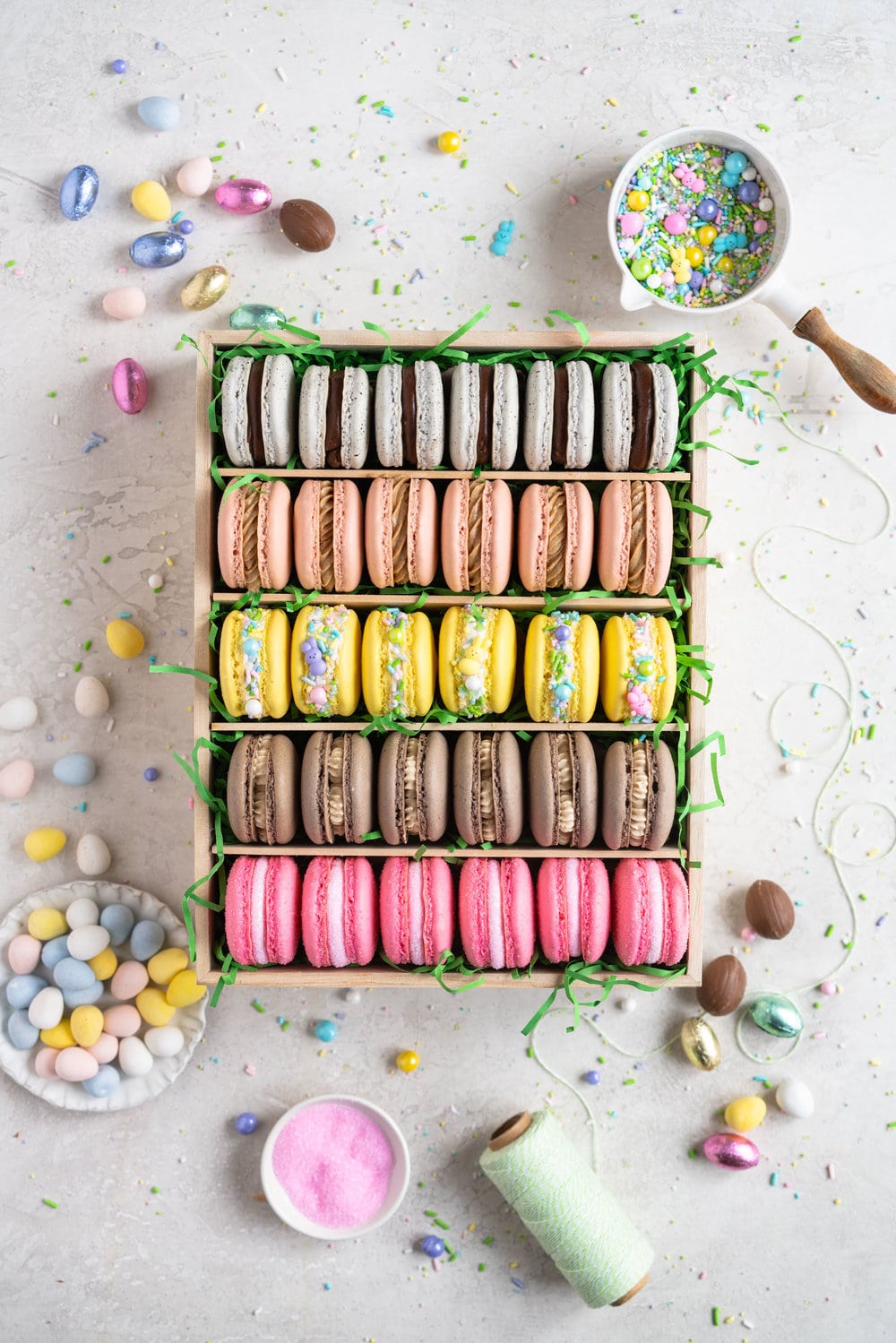 The ultimate Easter Macaron Box - creme egg macarons, hot cross bun macarons, coconut macarons, chocolate peanut butter macarons and peeps marshmallow macarons make up the most amazing Easter inspired box. This would make an incredible easter gift, and can be customised however you like!