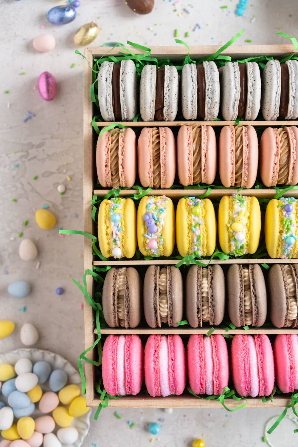 The ultimate Easter Macaron Box - creme egg macarons, hot cross bun macarons, coconut macarons, chocolate peanut butter macarons and peeps marshmallow macarons make up the most amazing Easter inspired box. This would make an incredible easter gift, and can be customised however you like!