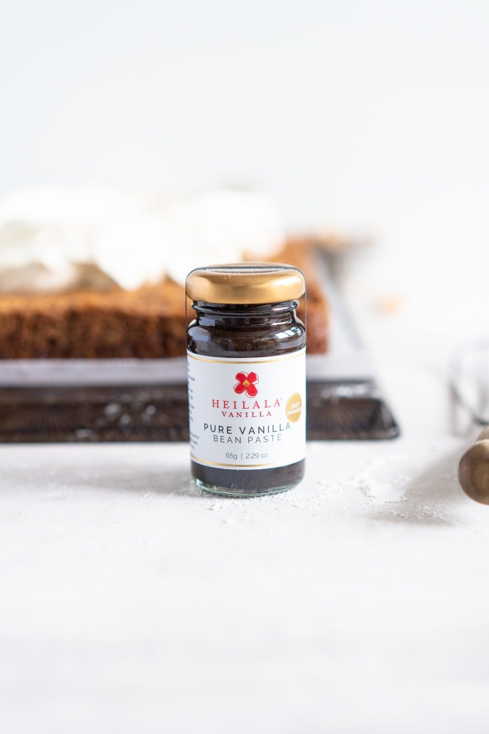 Brown Butter Carrot Sheet Cake is taken to the next level with a fluffy, whipped vanilla bean cream cheese german buttercream. This cake comes together super easily but is super delicious, and would make the perfect easter dessert. #brownbutter #carrotcake #sheetcake #germanbuttercream